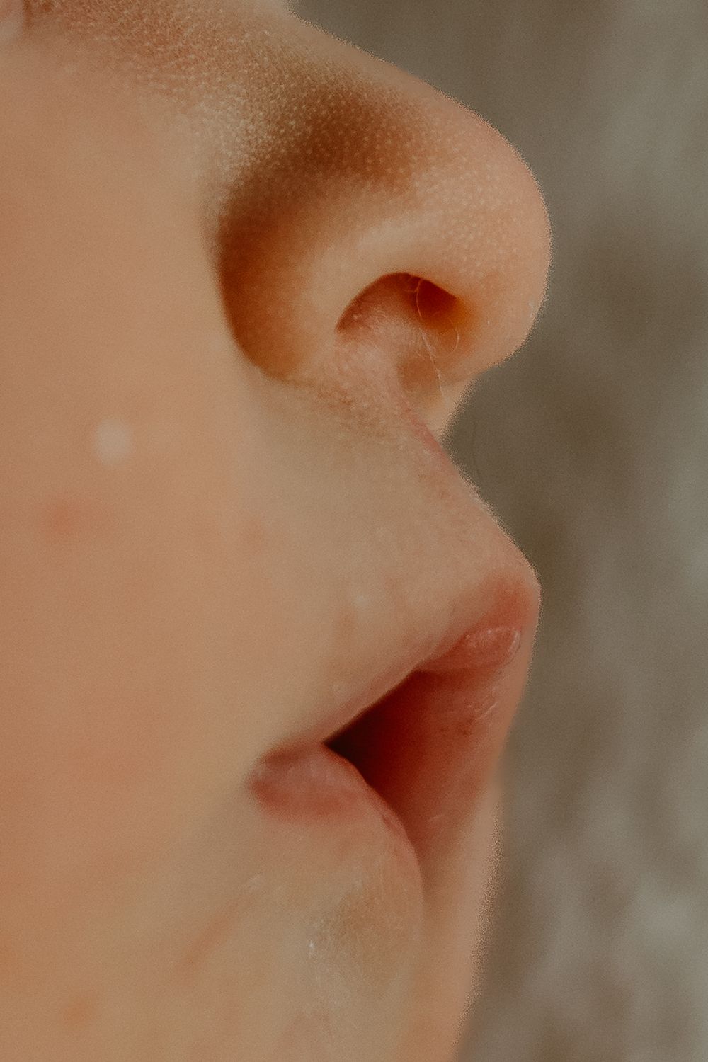 A close-up series of different angles and views of a human nose against a neutral blurred background.
