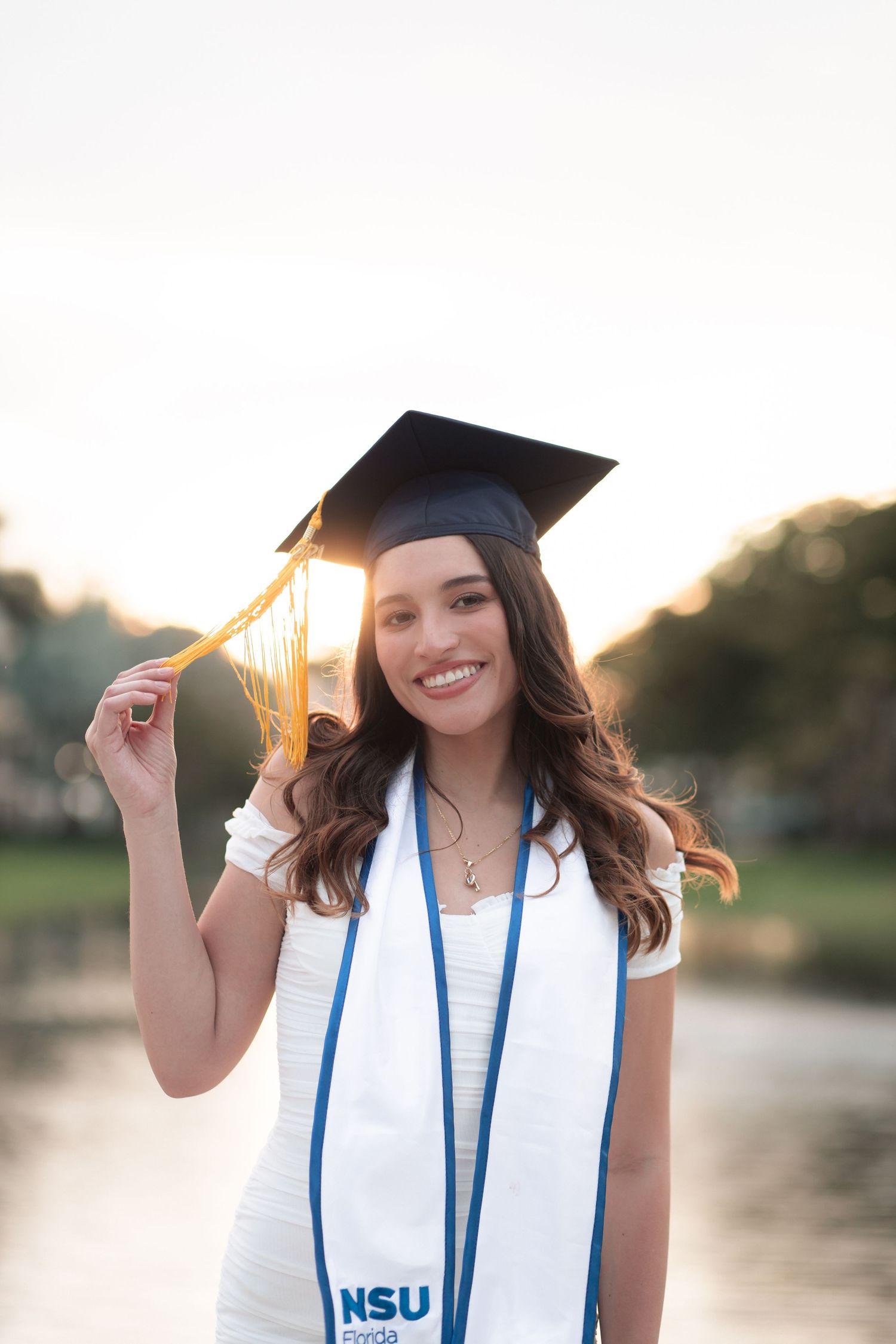Graduation portrait photographer in Miami and Fort Lauderdale — cinematic senior photos for FIU, UM, FAU, and NSU students.