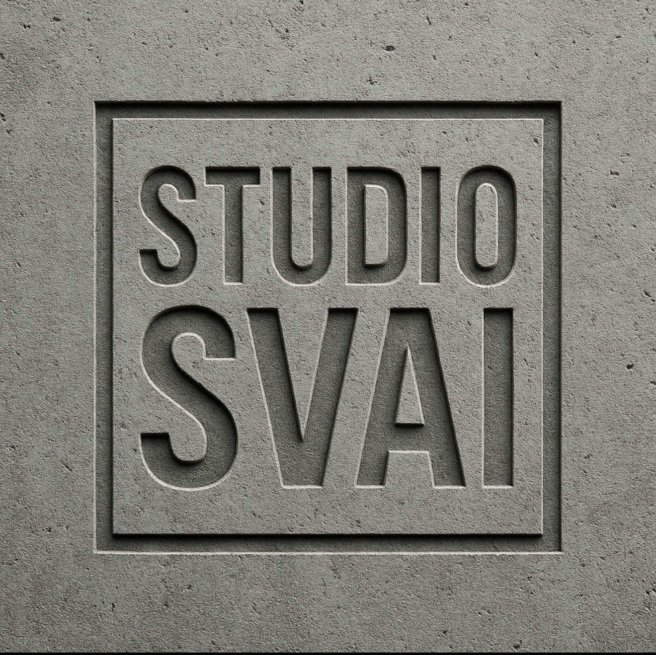 Minimalist concrete wall texture with embossed studio branding design.