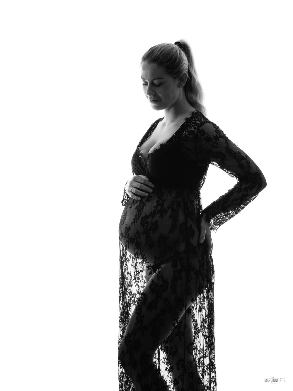 Silhouette sequence of a pregnant woman in a black lace dress posing against white background.