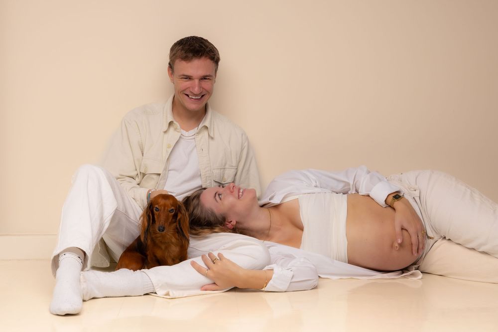 A sequence of photos showing a person sleeping in different positions with a brown cat on a white bed.