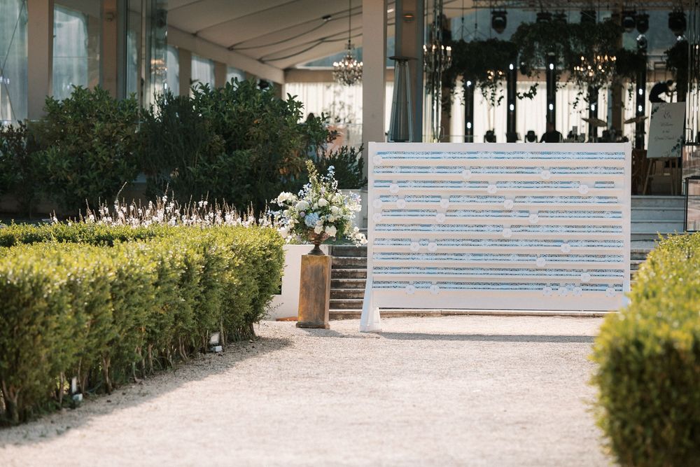 Wedding seating chart displayed in the gardens of Palácio do Correio-Mor, Portugal