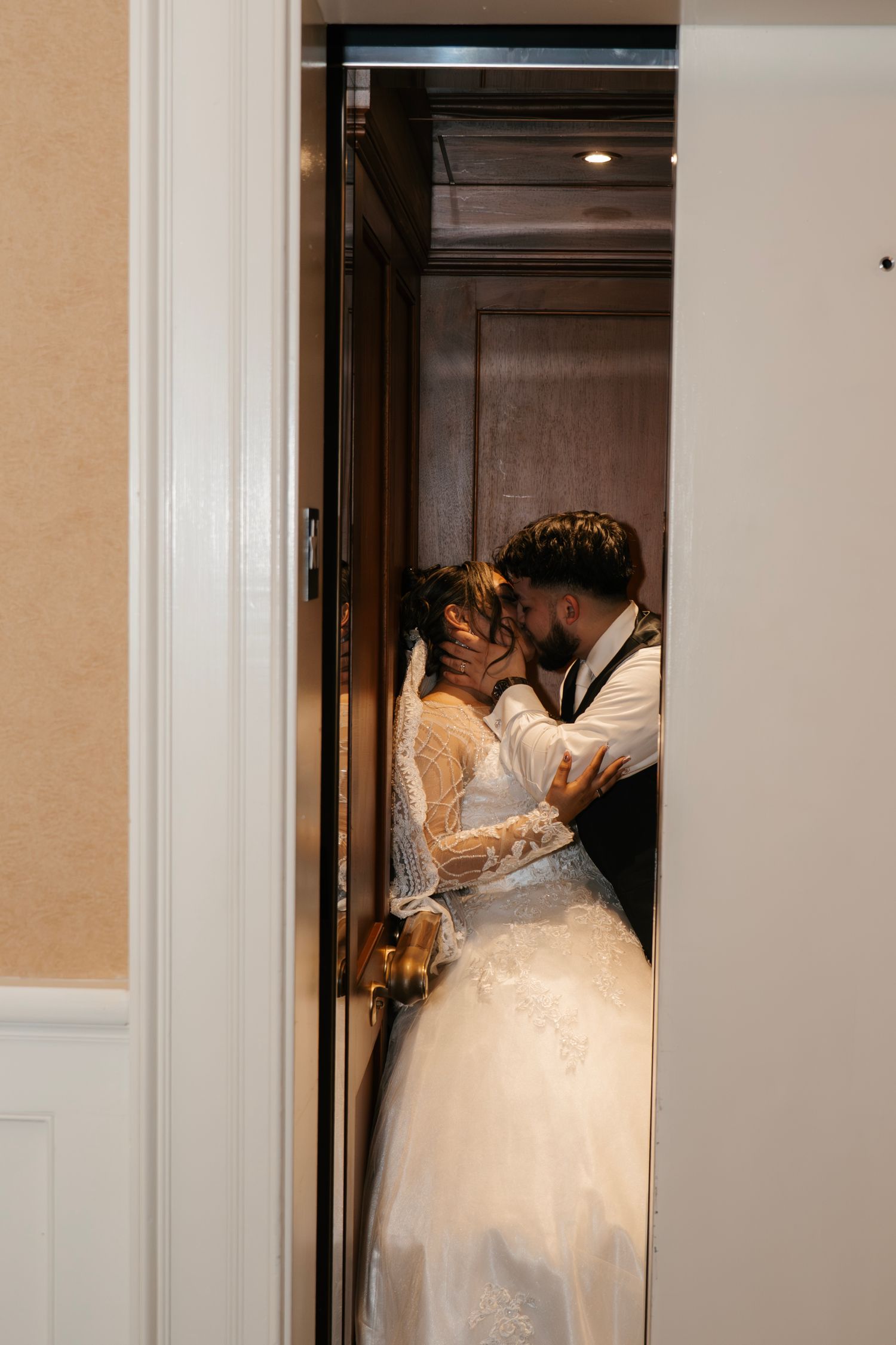 Bride and groom elevator flash photo at River Landing Clubhouse wedding in Wallace NC captured by AKL Photo & Films. 6 hr package at $4000