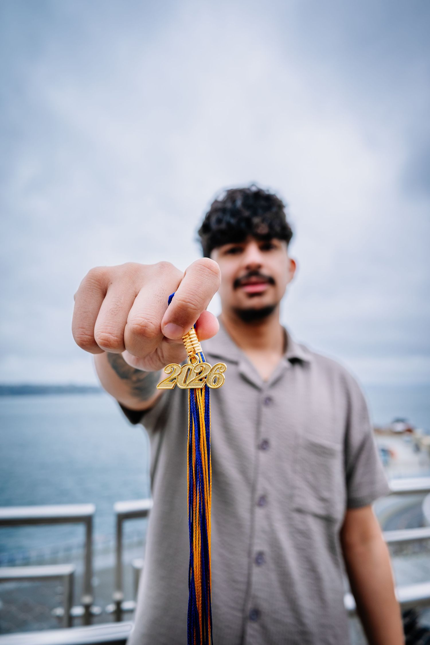 Close-up graduation tassel detail in senior portrait