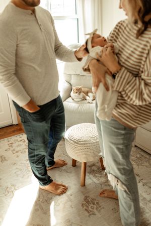 A sequence of five images showing someone placing a white crocheted cushion cover on a small wooden stool.