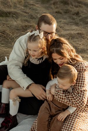 A sequence of candid outdoor photos showing tender family moments at sunset with warm autumn lighting.