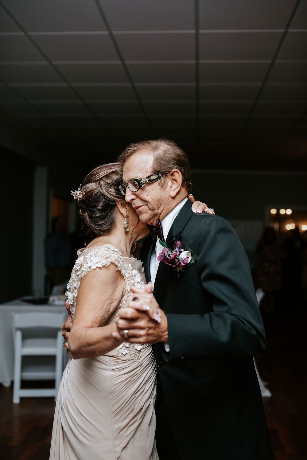 A collection of romantic dance moments captured at an indoor wedding reception with dim lighting.