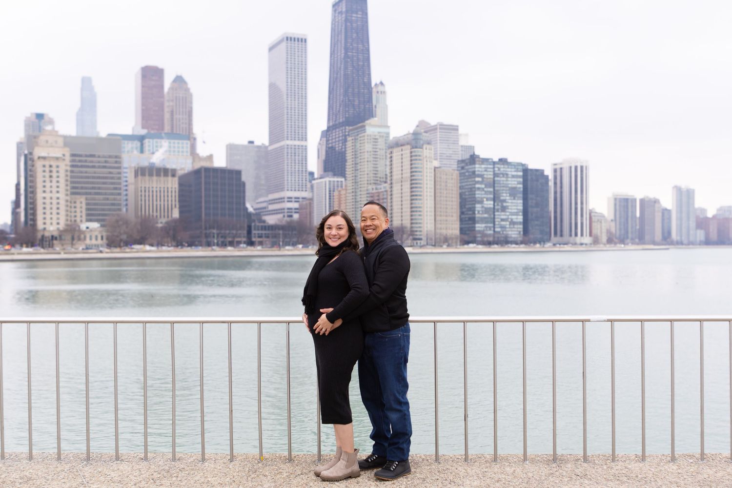 Friends enjoying a sunset stroll along Chicago's waterfront with the iconic skyline in the background.