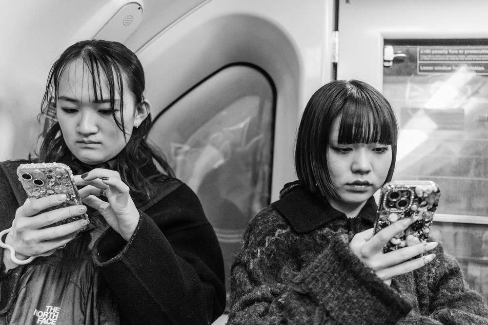 A collection of monochrome photos showing people eating and enjoying various foods at different locations.