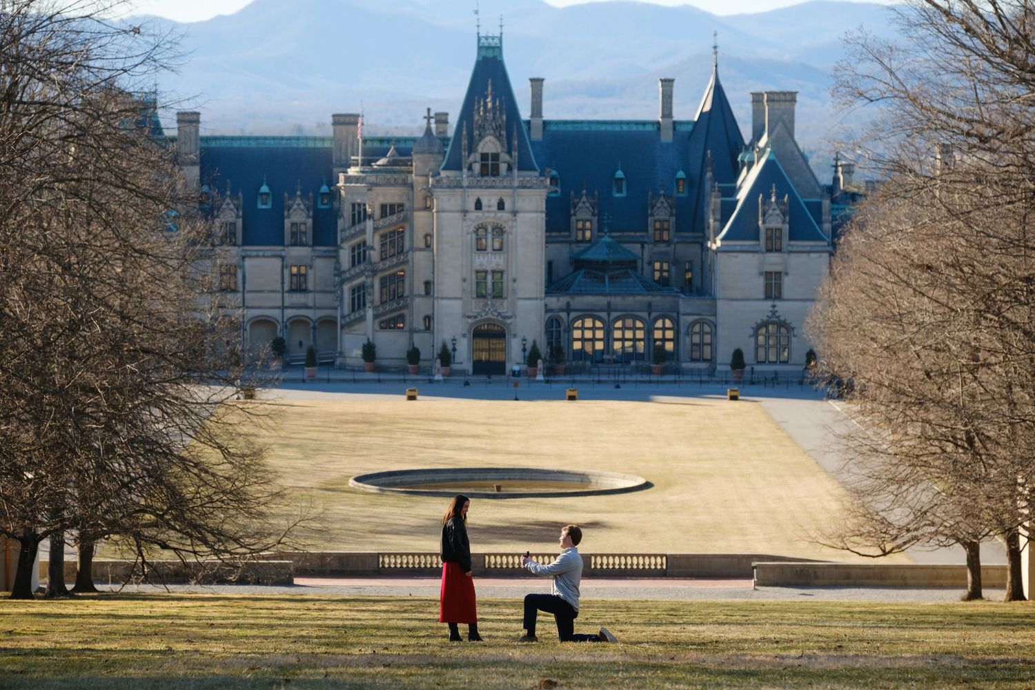 Michael proposing to Erin during a surprise Friday the 13th proposal at the Biltmore Estate in Asheville North Carolina.