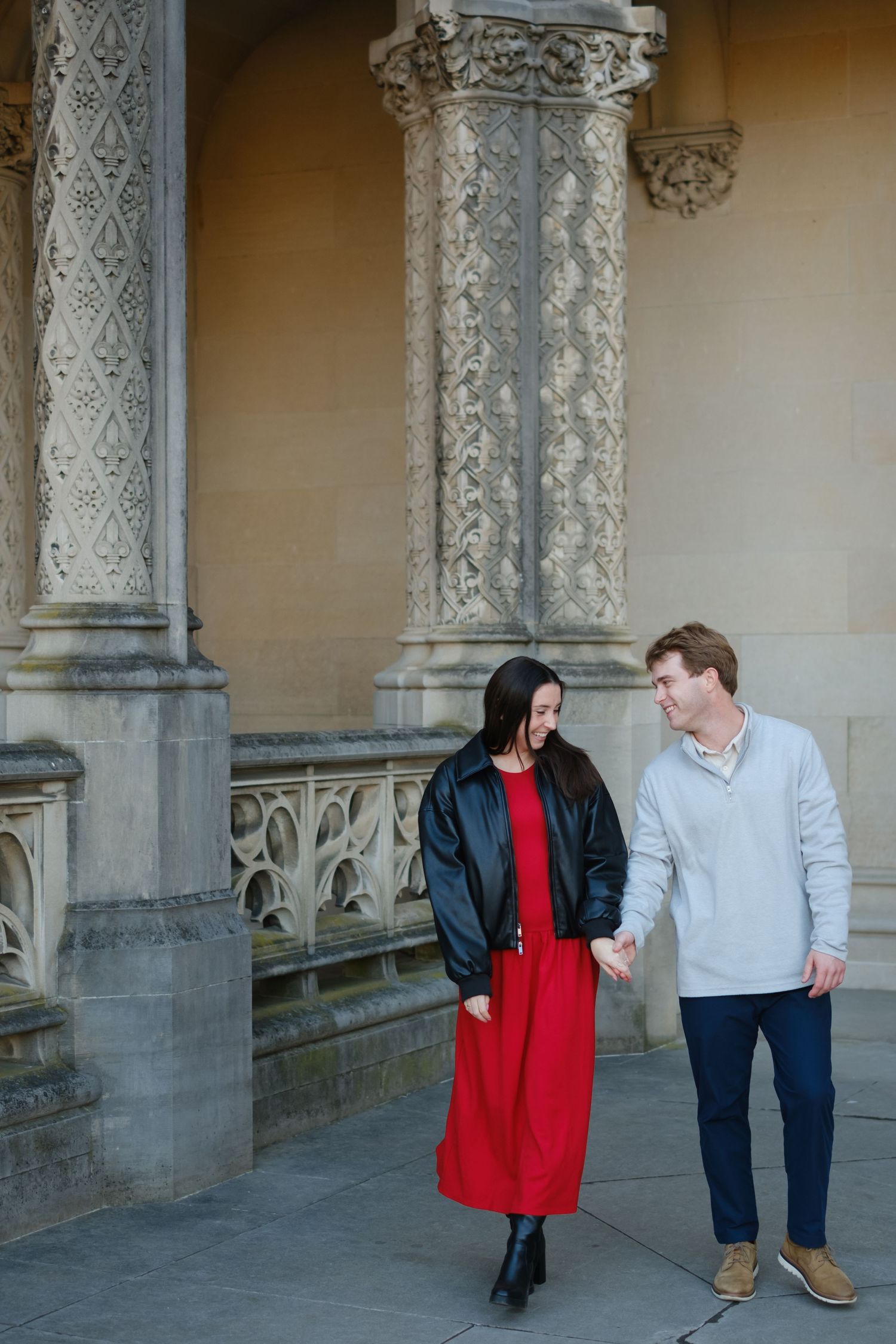 Engaged couple in front of the historic Biltmore Estate mansion in Asheville North Carolina photographed by Stephanie A Smith Photography