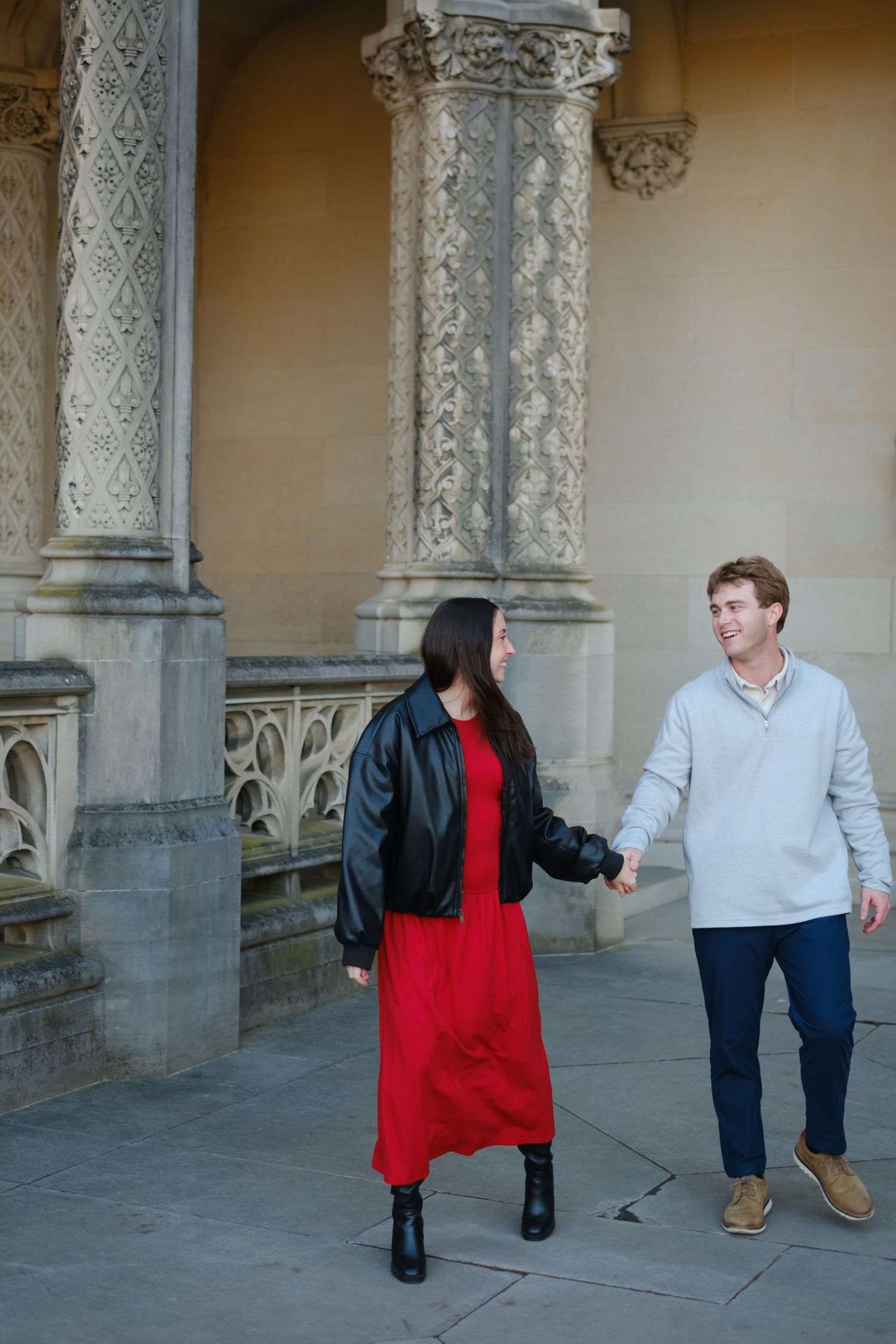 Playful newly engaged couple laughing together after their Biltmore Estate proposal in Asheville NC