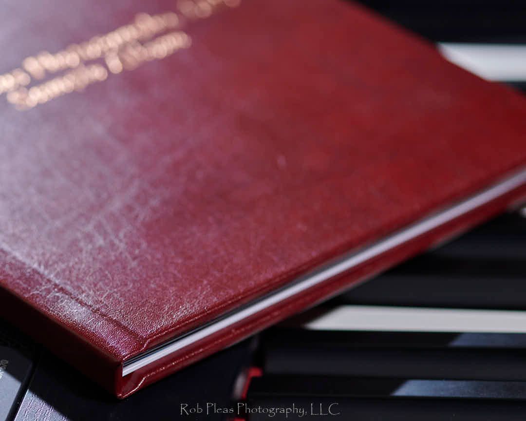 Side view of high school senior memory album from Rob Pleas Photogrphy, LLC.  Leatherette cover.  Show closeup of leatherette detail.