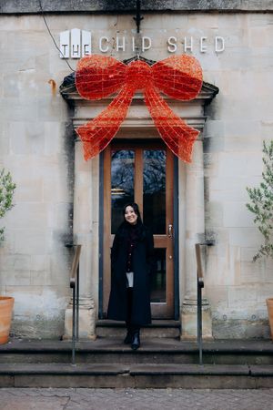 Cotswolds family photographer capturing portraits by the river in Bourton-on-the-Water.