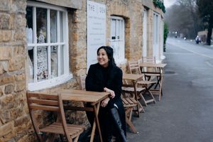 Cotswolds family photographer capturing portraits by the river in Bourton-on-the-Water.