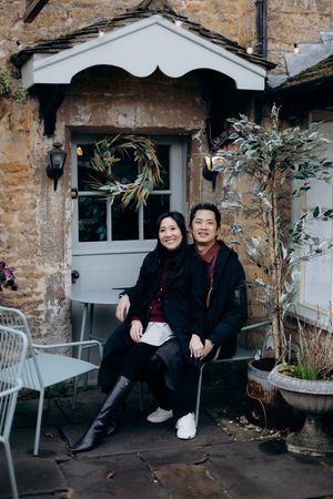 Cotswolds family photographer capturing portraits by the river in Bourton-on-the-Water.