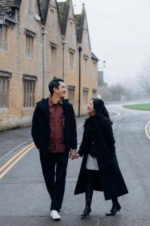 Cotswolds family photographer capturing portraits by the river in Bourton-on-the-Water.