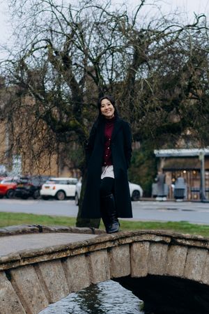 Cotswolds family photographer capturing portraits by the river in Bourton-on-the-Water.