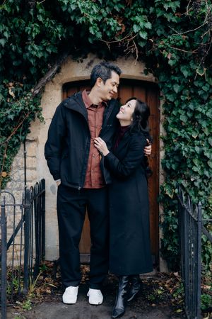 Cotswolds family photographer capturing portraits by the river in Bourton-on-the-Water.