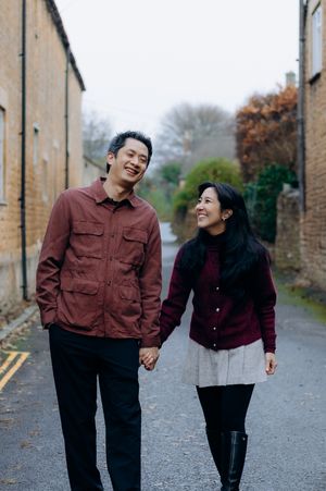 Cotswolds family photographer capturing portraits by the river in Bourton-on-the-Water.