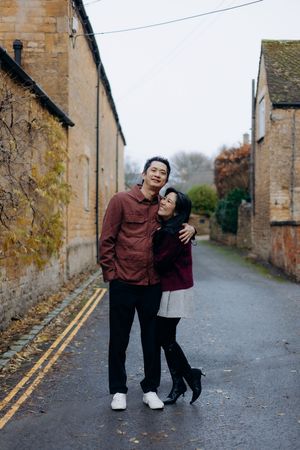 Cotswolds family photographer capturing portraits by the river in Bourton-on-the-Water.