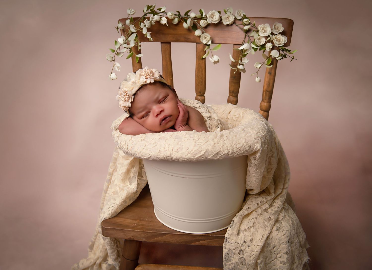 A series of professional newborn photography images showing a sleeping baby posed in white bowls and wooden props.