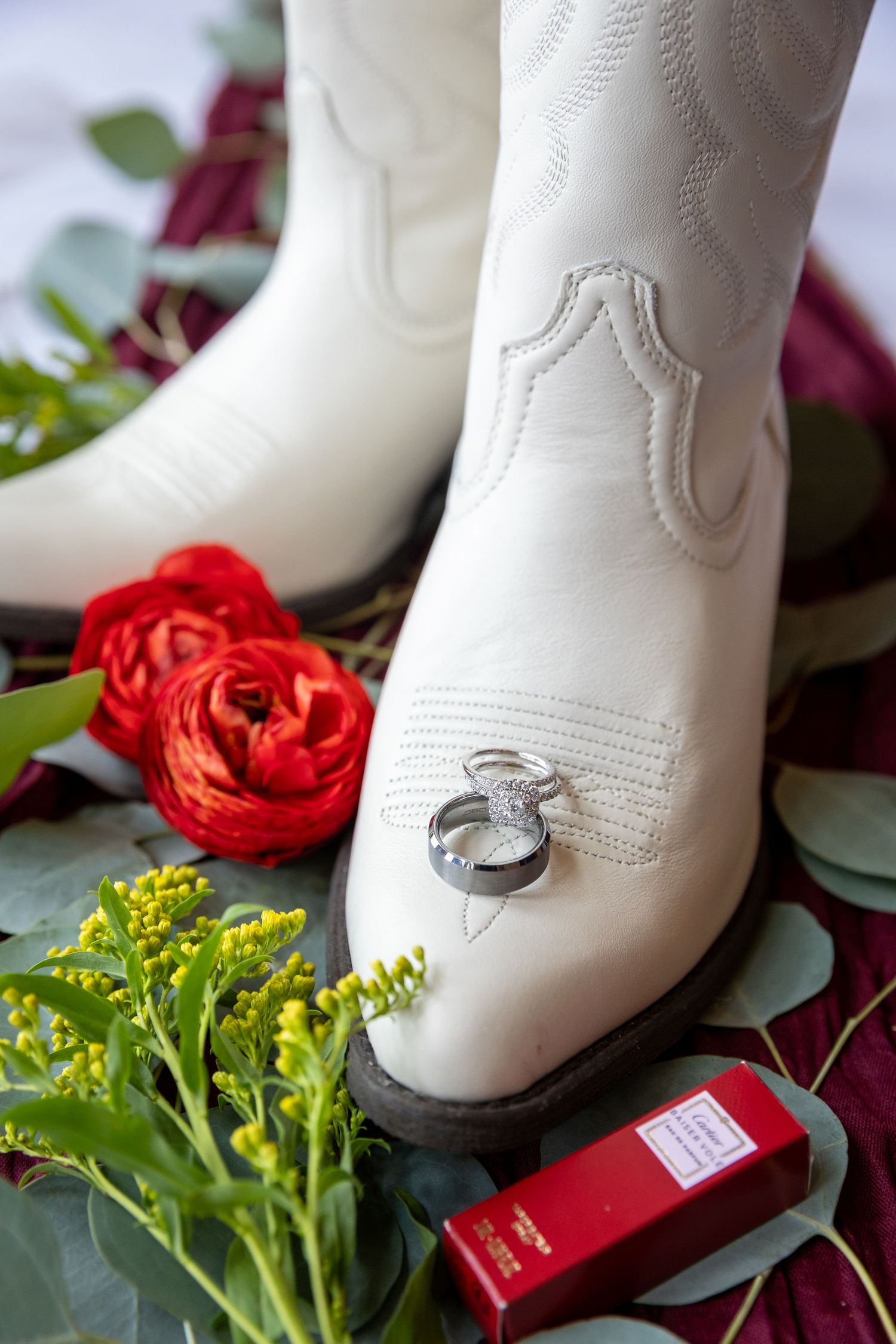 A bride and groom share a joyful moment together outdoors during their wedding celebration.