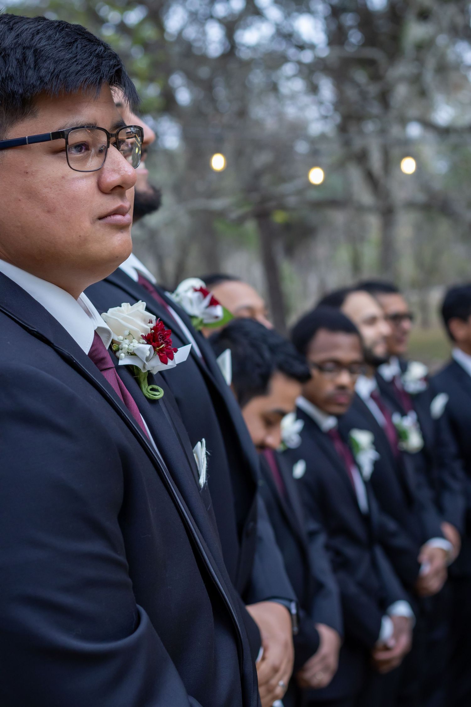 A bride and groom share a joyful moment together outdoors during their wedding celebration.