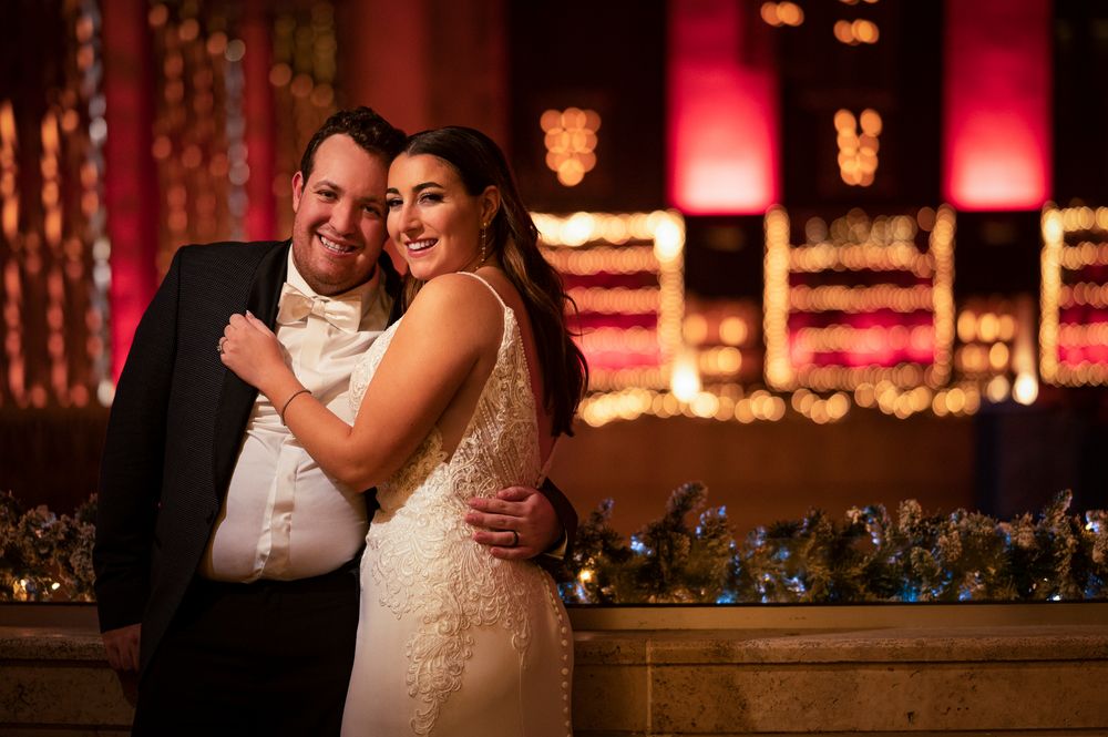 A romantic wedding reception at Union Trust in Philadelphia with warm lighting and elegant decor creates an intimate atmosphere.
