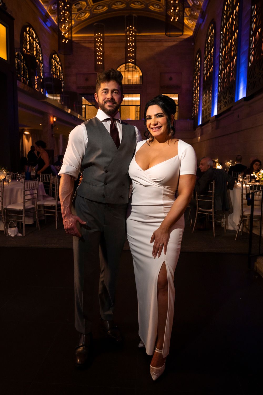 A couple shares an intimate moment on their wedding day in an elegantly lit reception at a Union Trust wedding