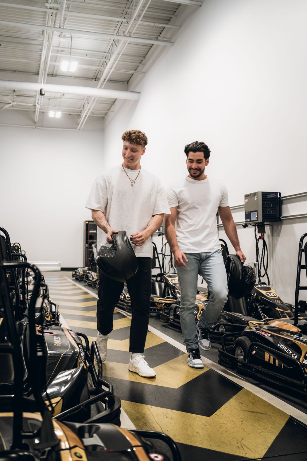 Two people walking through an entertainment venue with gaming equipment. Mtlshutter photography