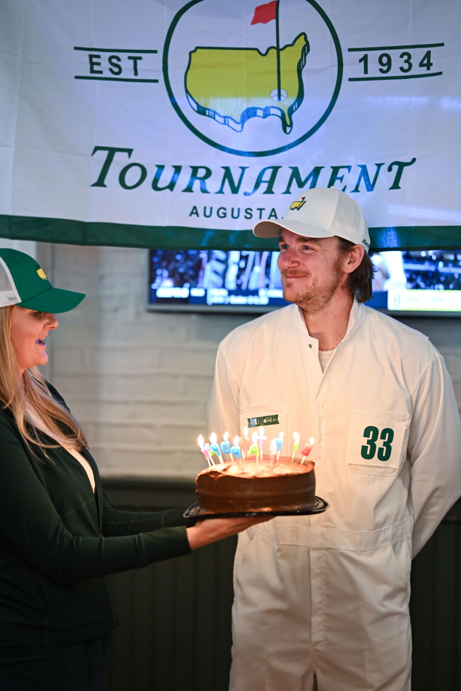 Brian celebrates his birthday with a cake and candles ablaze at a venue in Chicago's West Loop