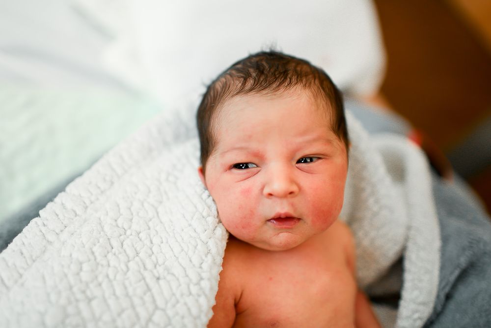 newborn baby girl yawning for fresh 48 session