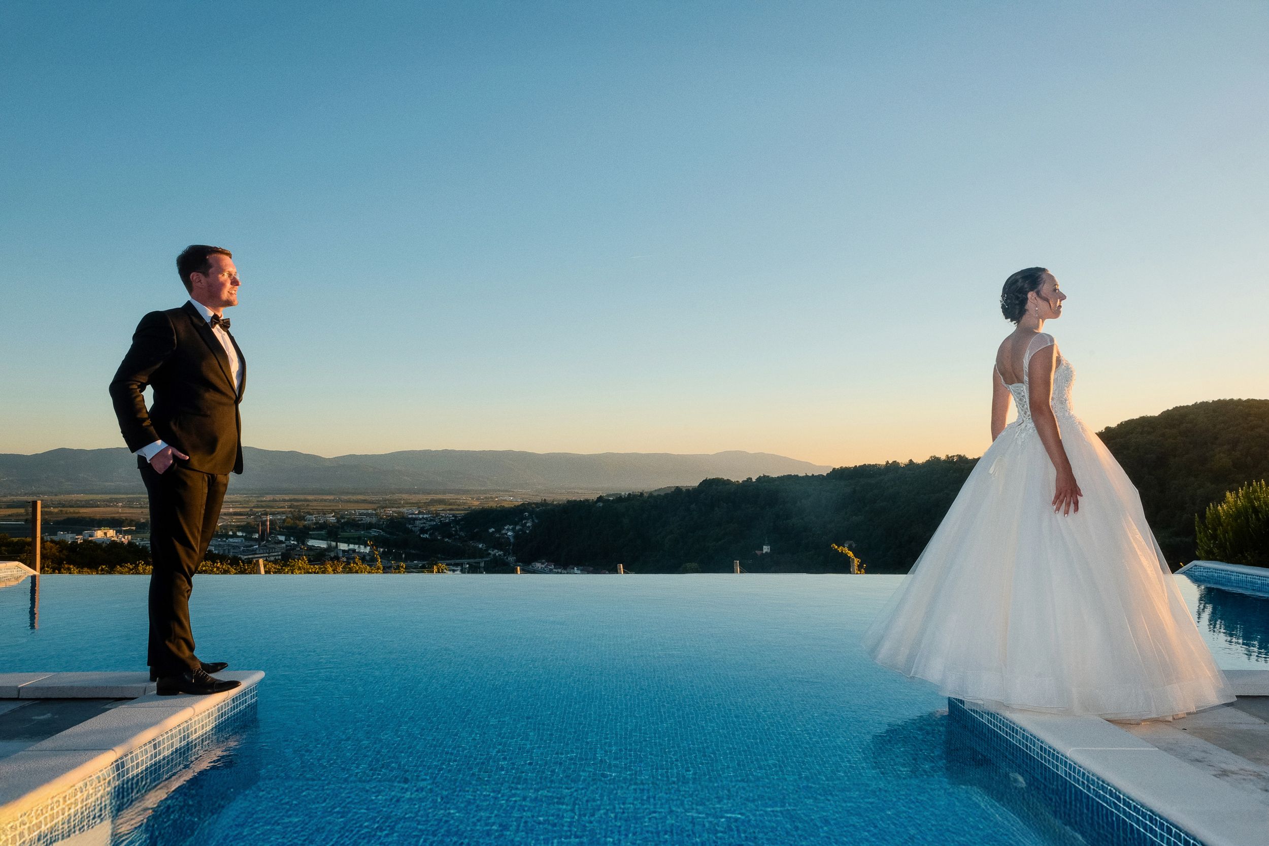 Romantic wedding portrait with sweeping mountain vista at sunset. Restavracija Tri Lučke, Krško
