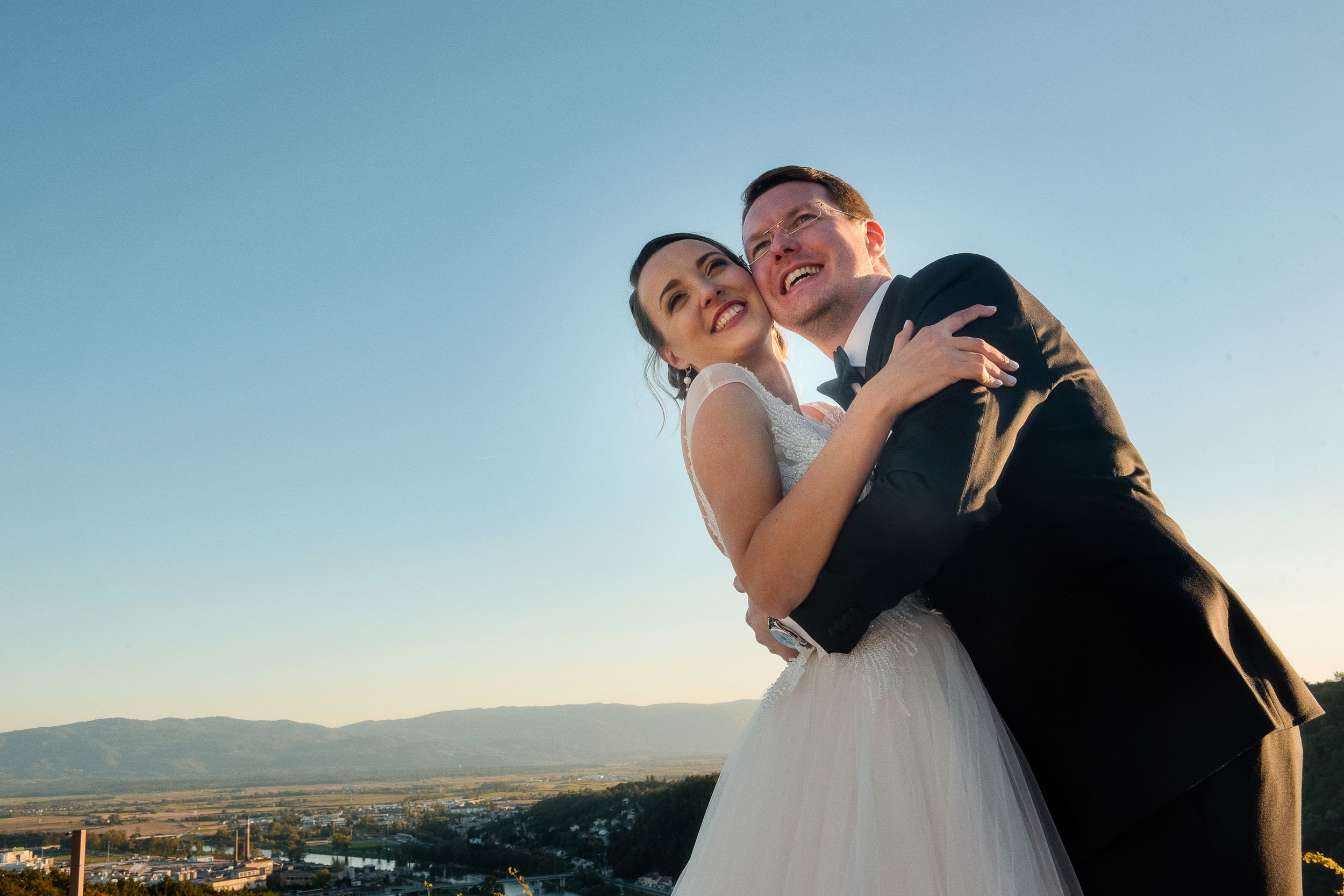 Elegant wedding couple sharing romantic moment at sunset. Restavracija Tri Lučke, Krško