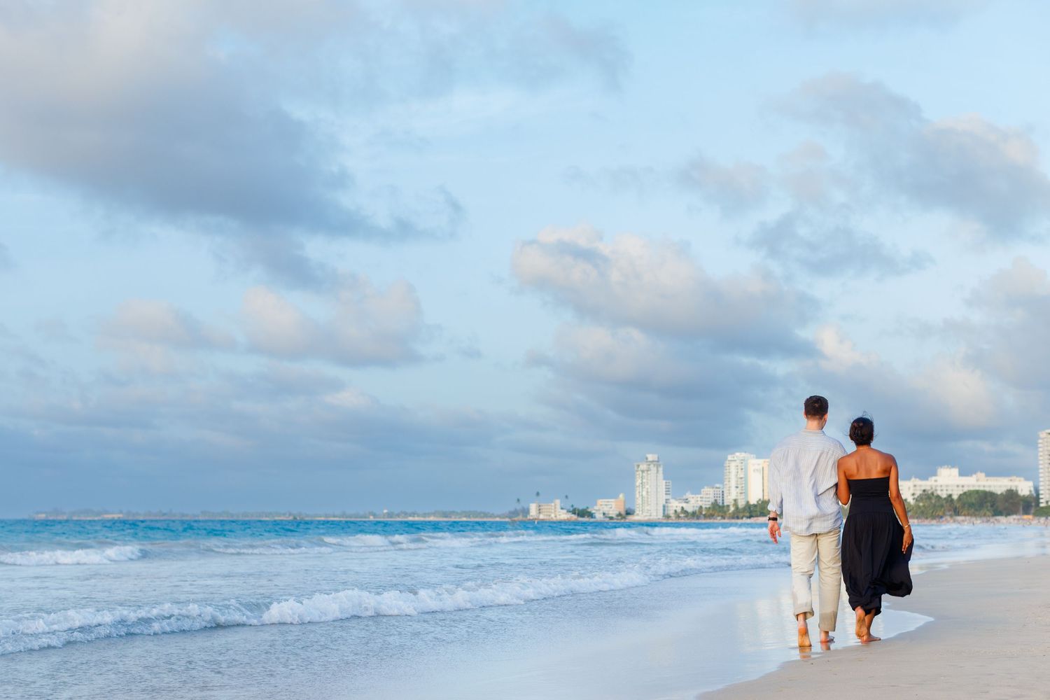Couples portrait. Marriage proposal on the beach in Isla Verde, Carolina, Puerto Rico.