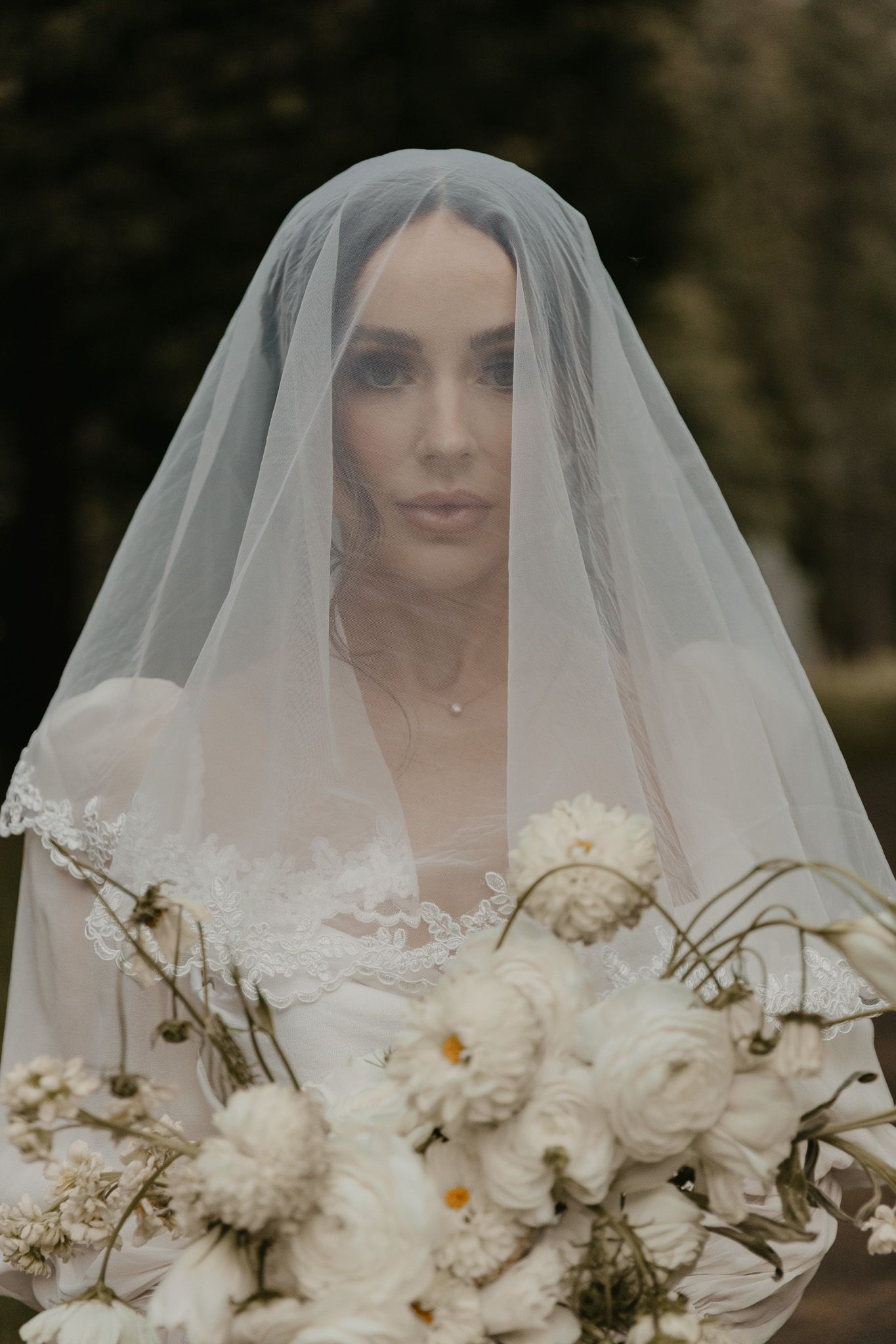 A wedding portrait sequence showing a bride in a cathedral veil holding a white floral bouquet.