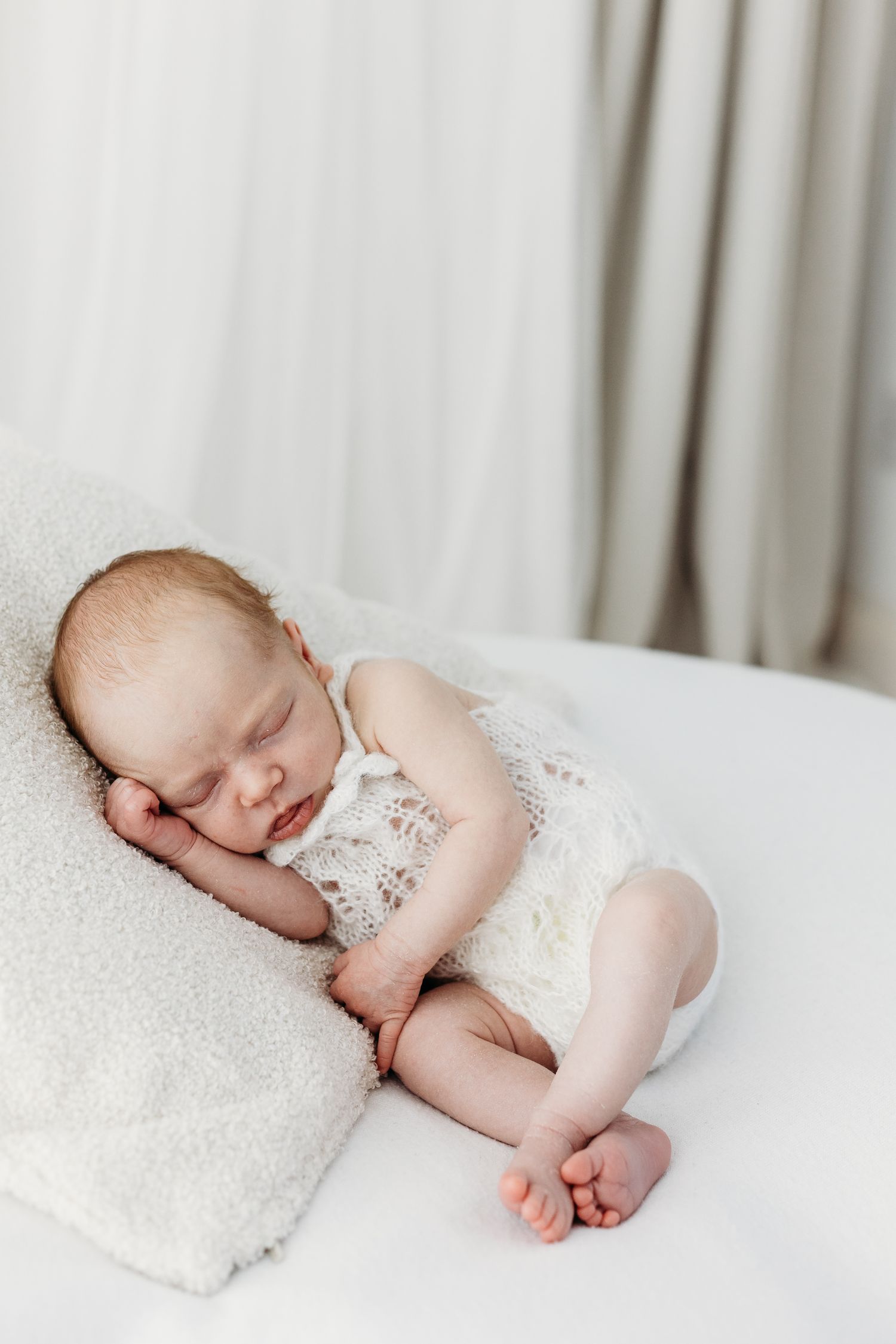 Tiny newborn toes and fingers photographed in Nottingham studio, timeless portraits created with soft natural light and minimal style.