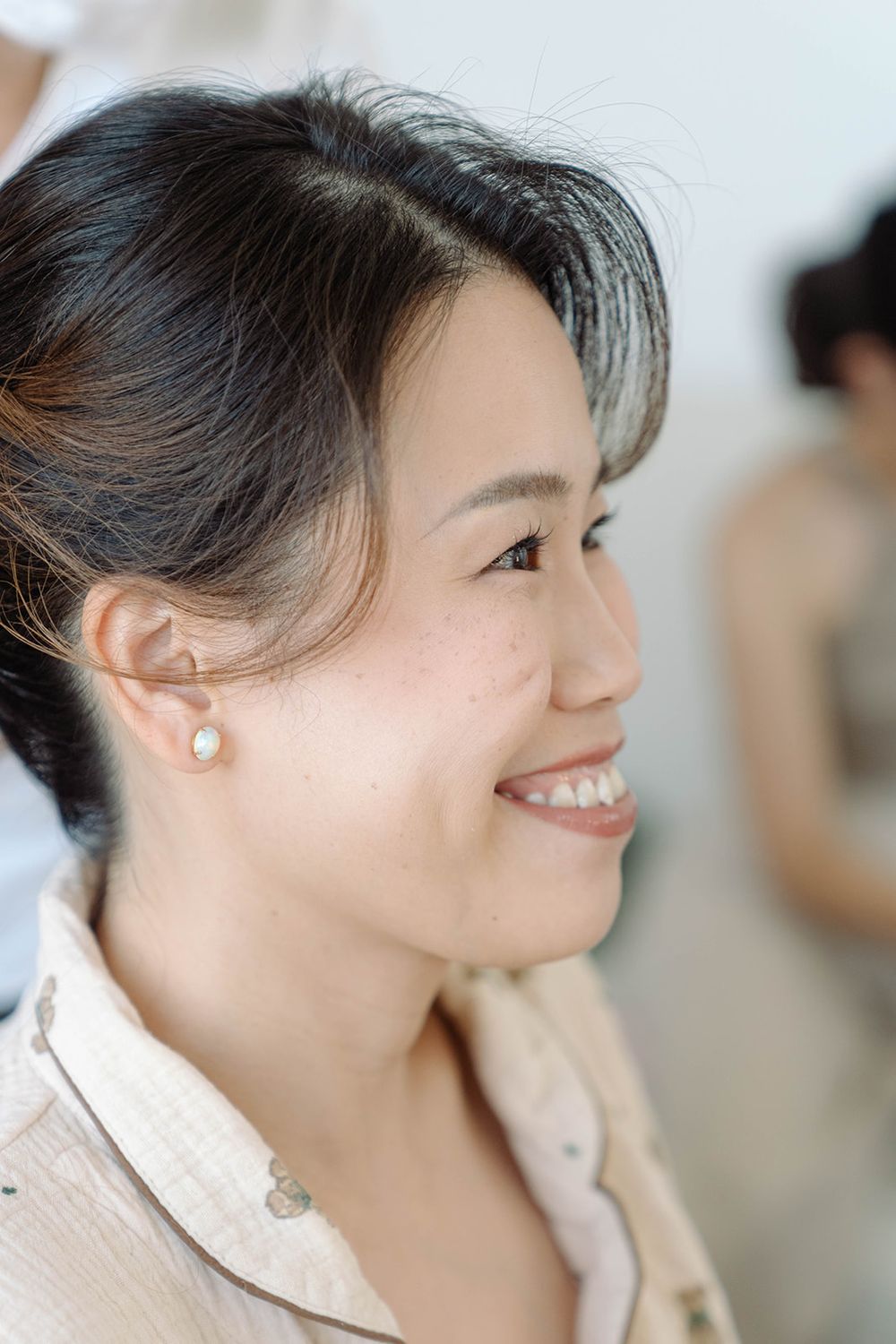 Side profile view during a professional hair styling session.