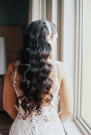 Four sequential views show a person in a white lace wedding dress with dark wavy hair looking out a window.