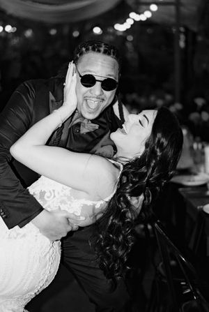 Black and white photo of a couple sharing an intimate dance moment at their wedding reception.