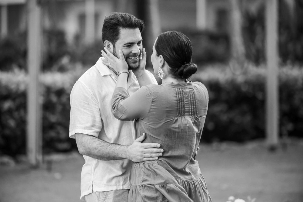 An intimate black and white portrait of a couple embracing during a special moment.