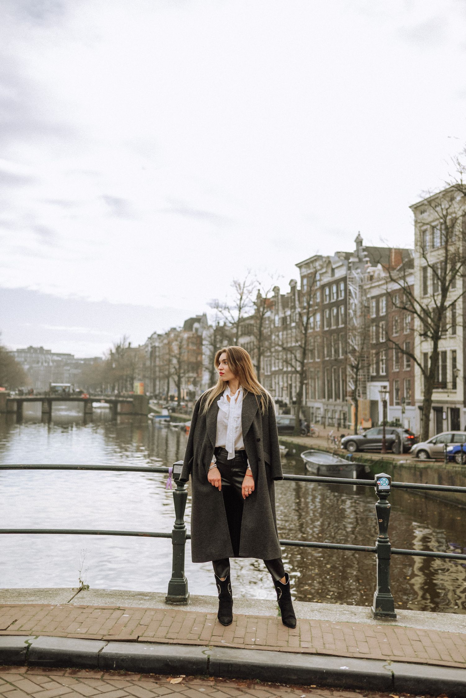 A woman on one of the Nine Streets' bridges in Amsterdam during her solo photoshoot.