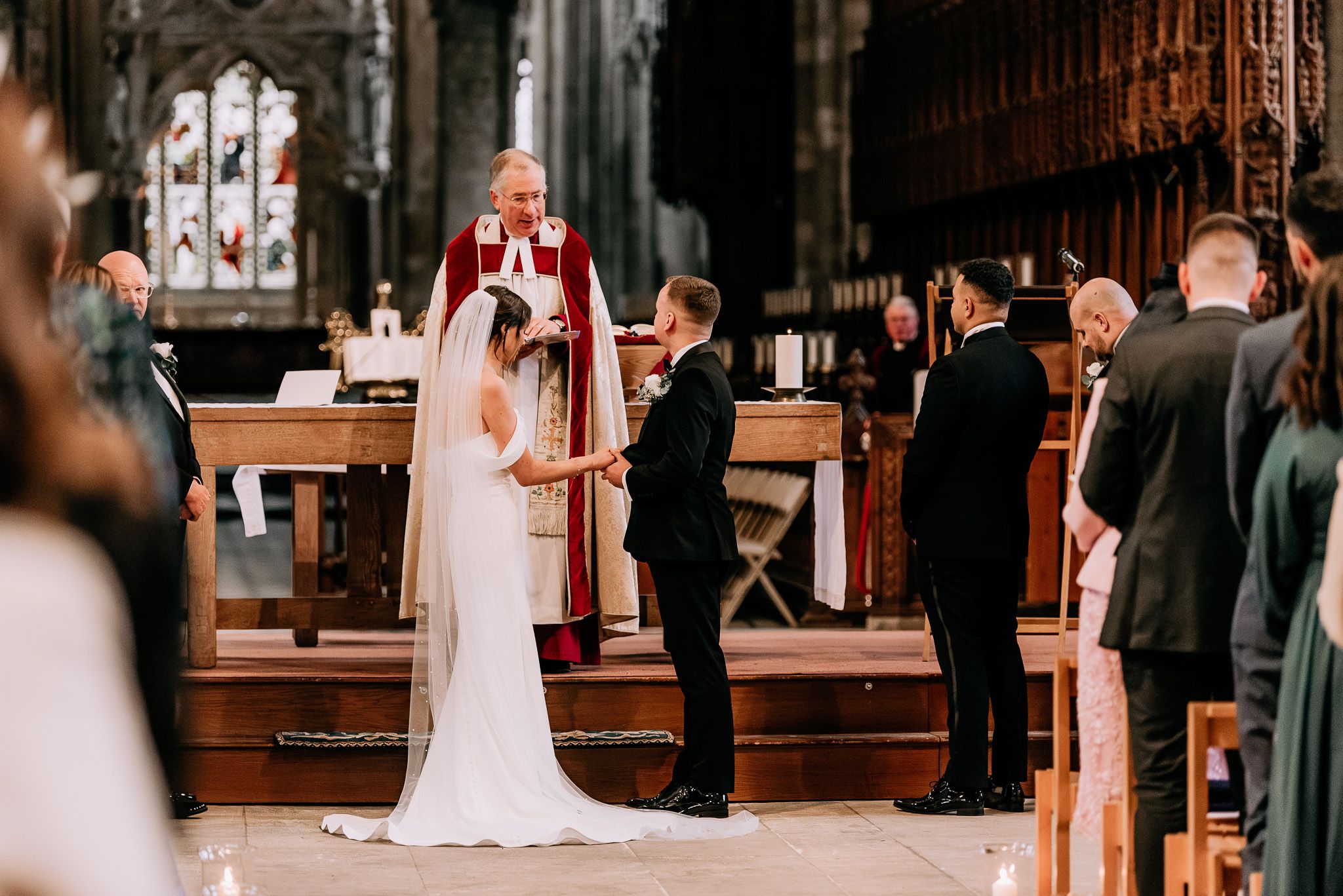 Elegant church interior filled with wedding guests during a traditional ceremony.