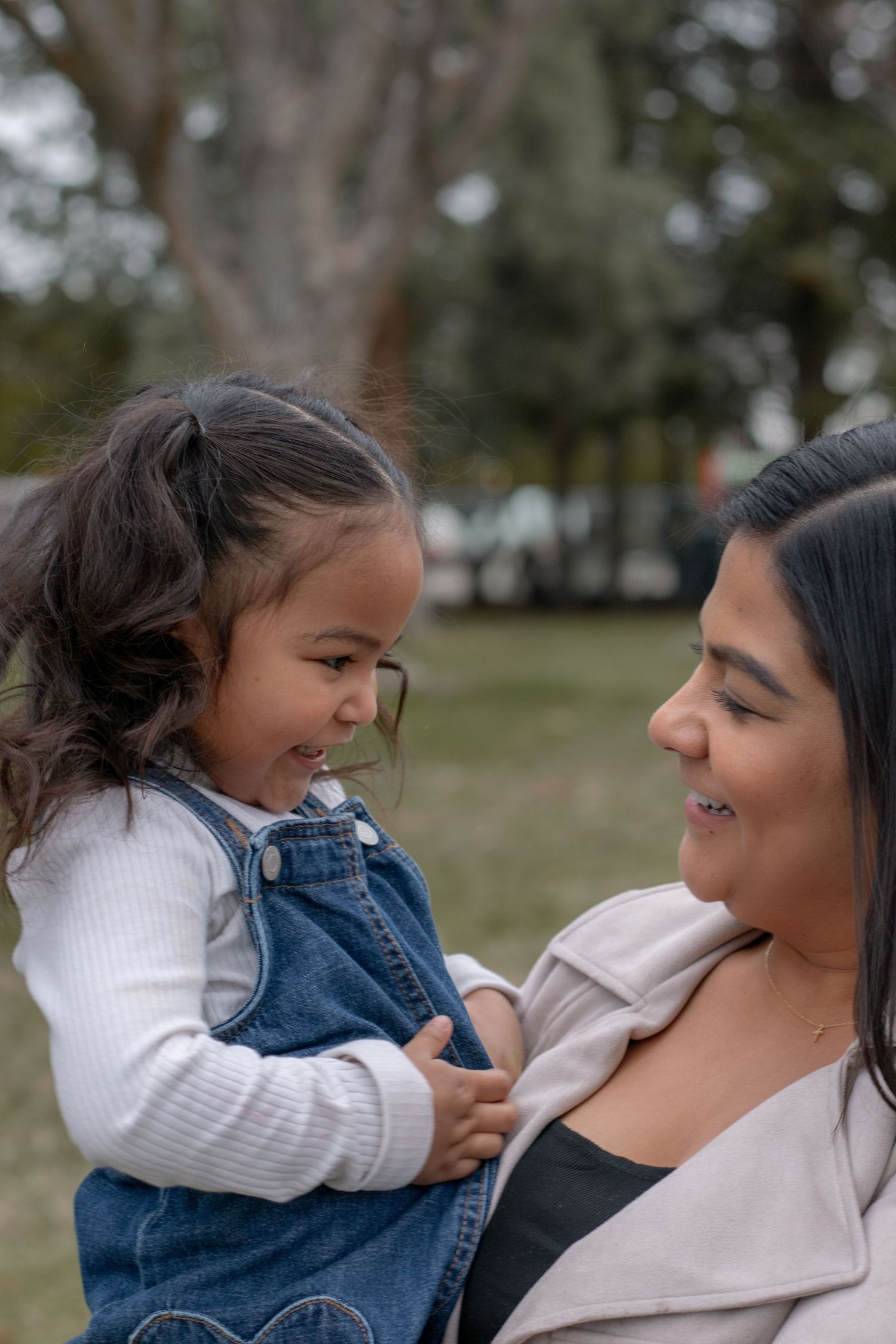 Candid moment between mom and daughter during natural light family session in Tri-Cities WA