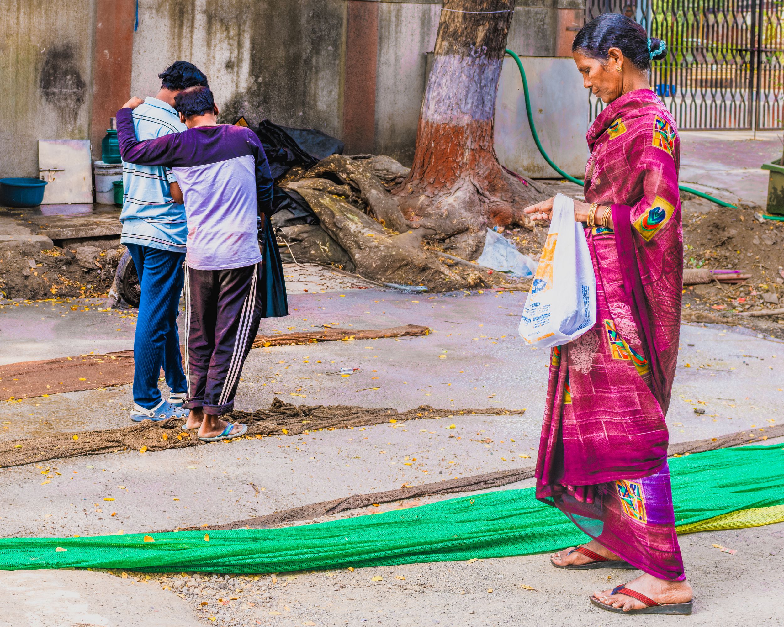 Street photography of people in colourful clothing walking along a city street