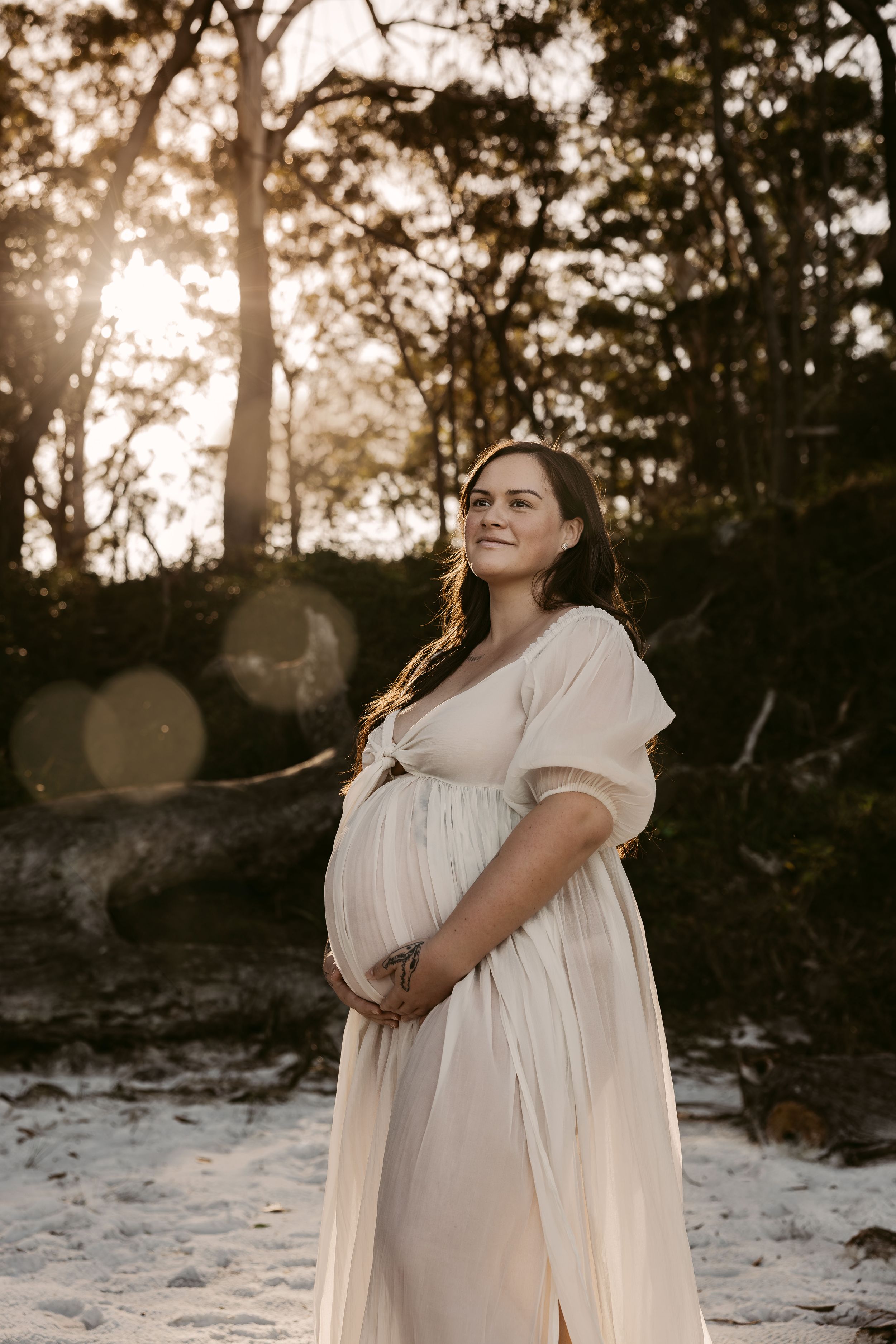maternity-sunset-photos-jervis-bay-greenfields-beach-vincentia-mum-to-be-holding-pregnatn-belly