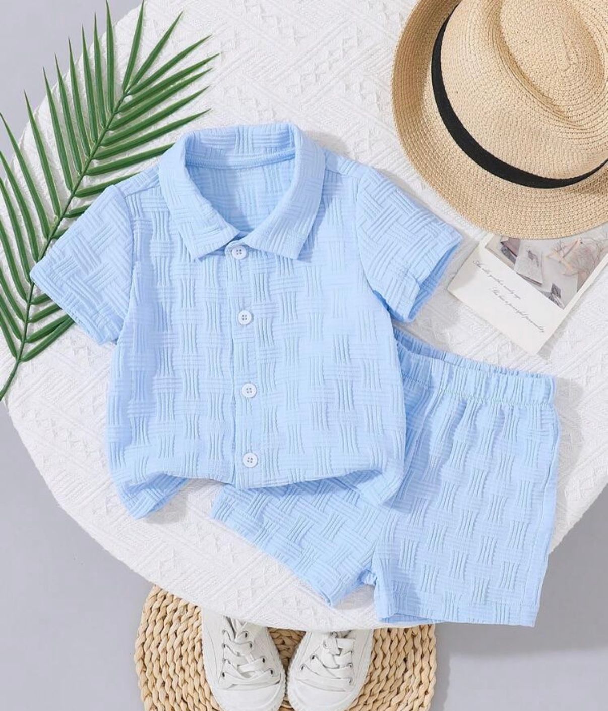 Light blue striped baby romper set with matching hat displayed on white background.