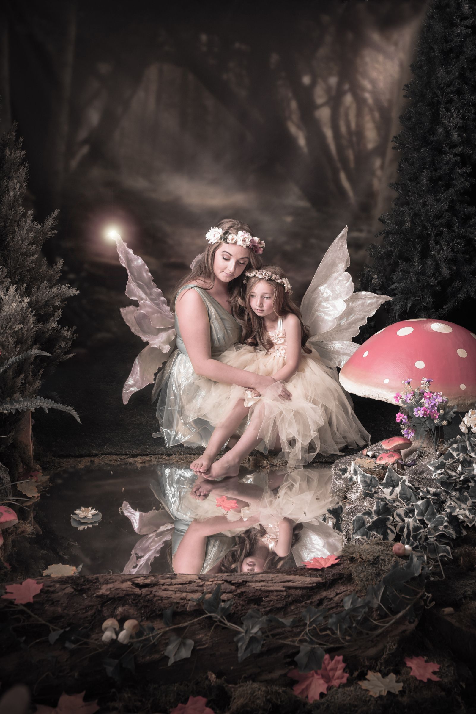 Ethereal fairy photography scene with reflections in water and magical mushrooms.