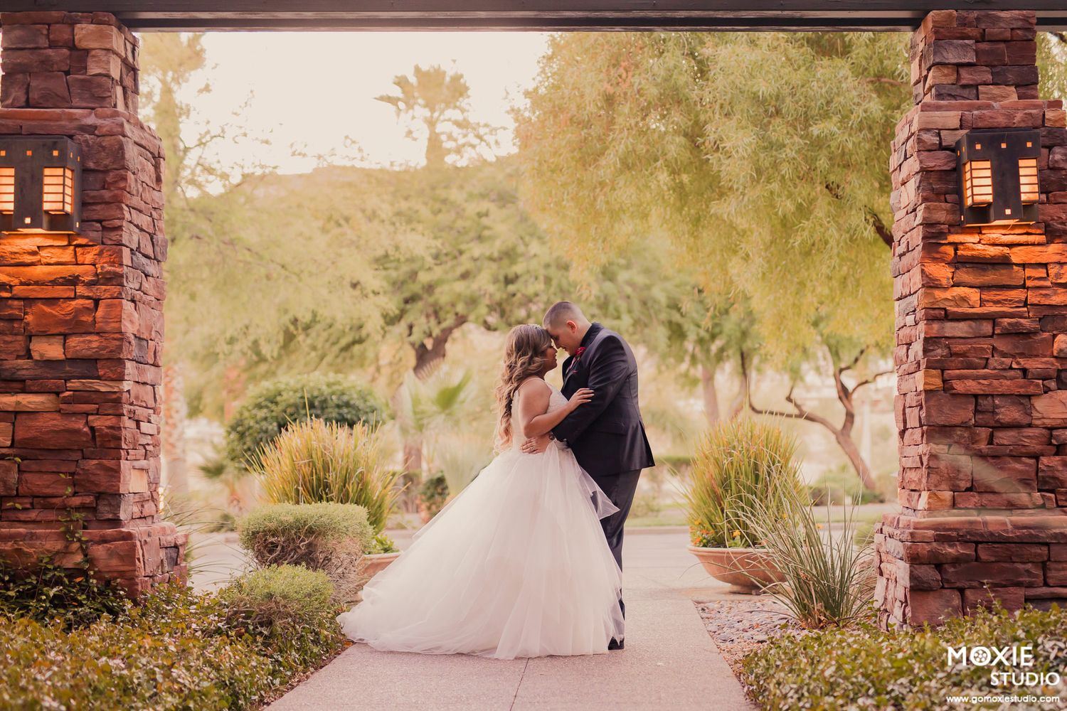 bride and groom portraits at DragonRidge Country Club sunset